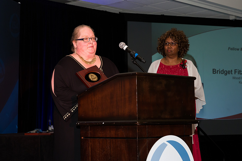 Bridget Fitzpatrick (left) gives her ISA Fellow 2016 acceptance speech; shown with Peggie Koon, PhD, 2014 ISA President.