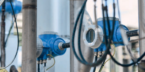 Figure 1: For specialty chemical manufacturers, Coriolis mass flowmeters with self-diagnostic technology support in situ testing and verification. (Shown: Promass F 300 with Heartbeat Technology)