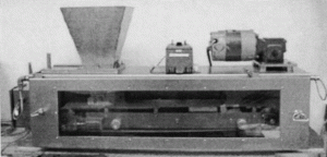 Self-Tuning Adaptive Control for an Industrial Weigh Belt Feeder