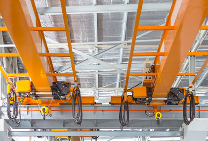 Experimental Verification of SMC with Moving Switching Lines Applied to Hoisting Crane Vertical Motion Control