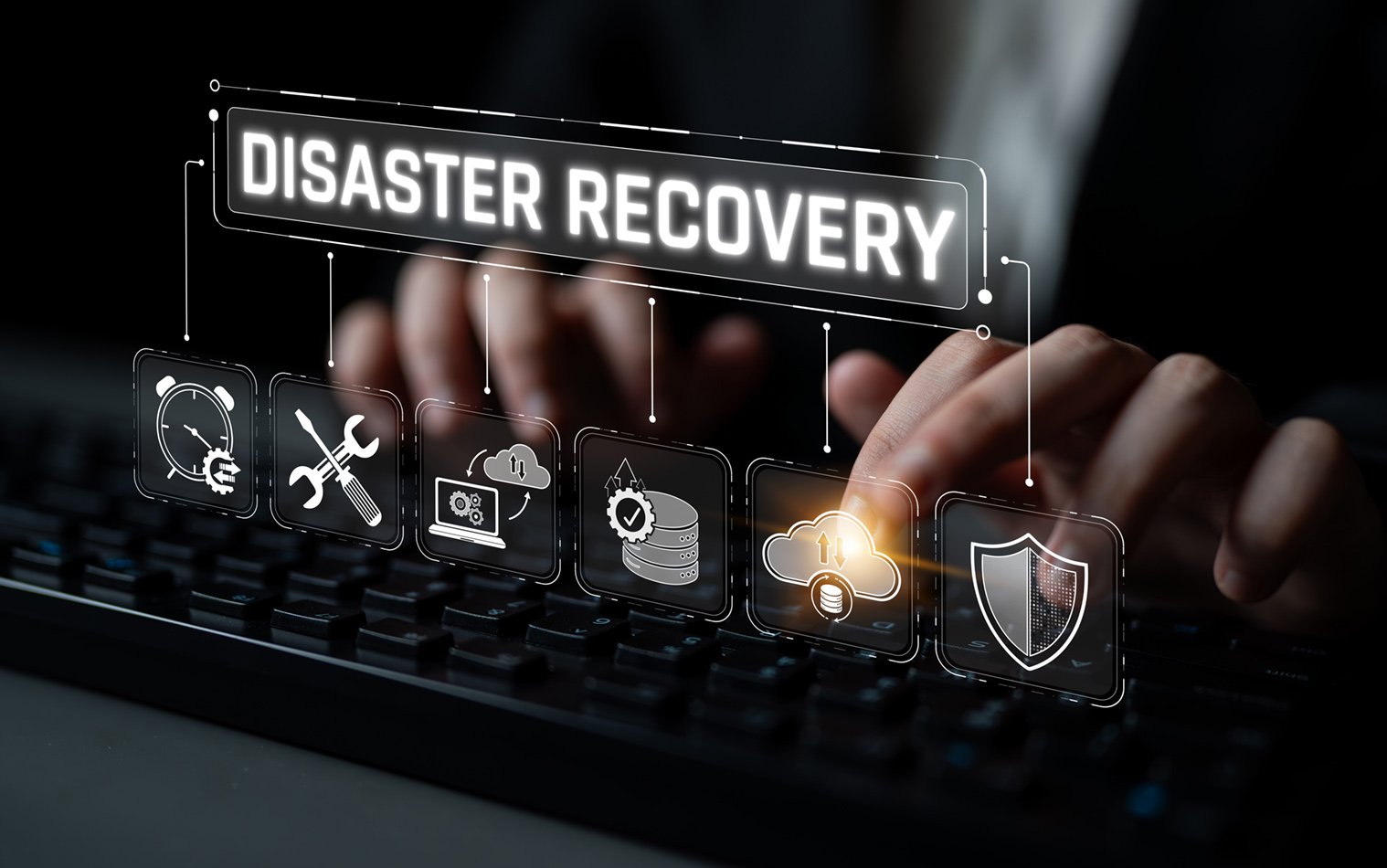 Hands typing on a keyboard with illustrated icons for disaster recovery, data protection, information security, and digital strategies.