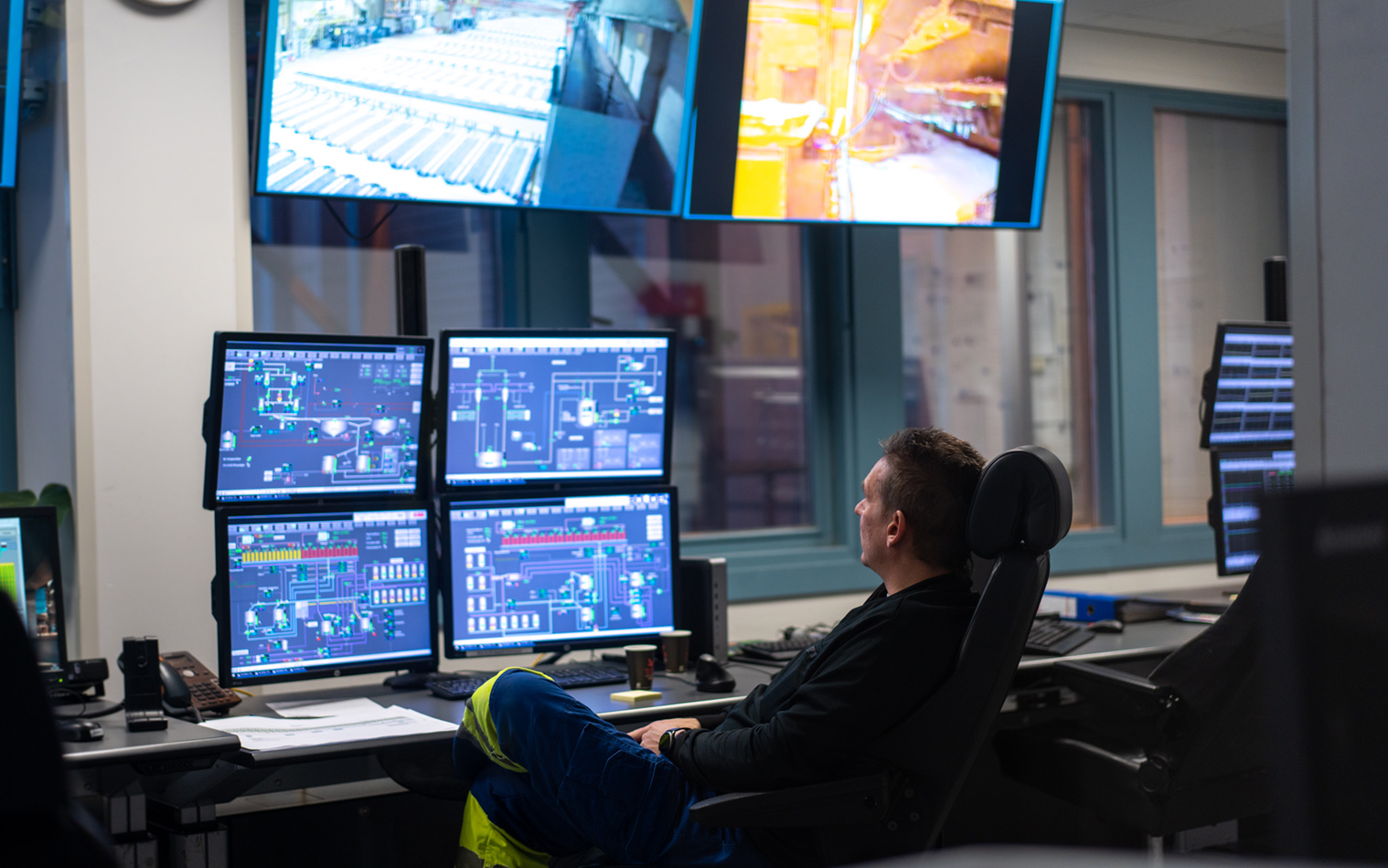 Engineer monitoring high-tech mining operations in the control center.